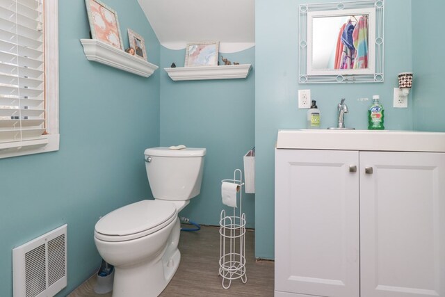 623 Bendle Ave, Shelby, OH 44875 - half bath featuring wood finished floors, toilet, and vanity