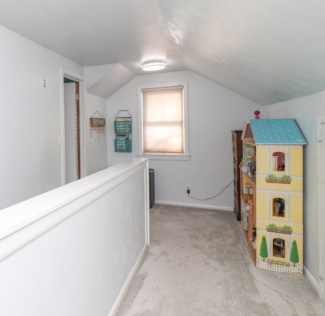 623 Bendle Ave, Shelby, OH 44875 - playroom with light carpet, lofted ceiling, and baseboards