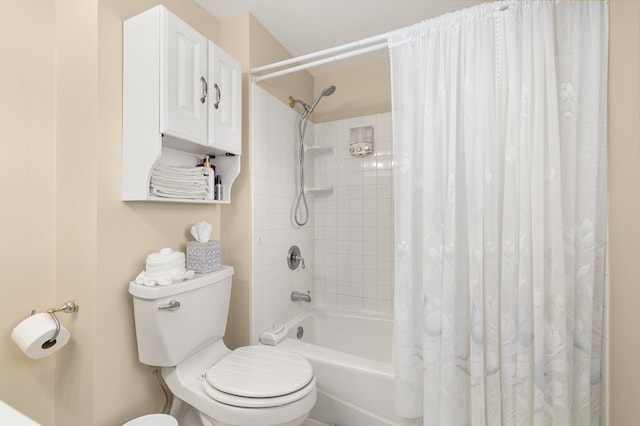 full bathroom featuring shower / bath combination with curtain and toilet