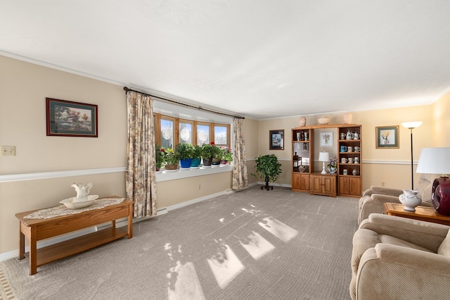 living room with carpet flooring, baseboards, and ornamental molding