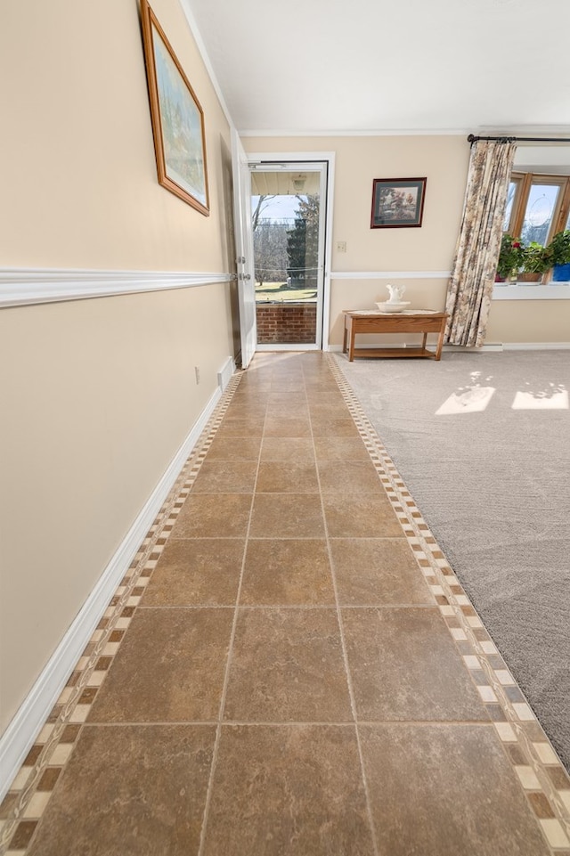 hall with carpet and baseboards