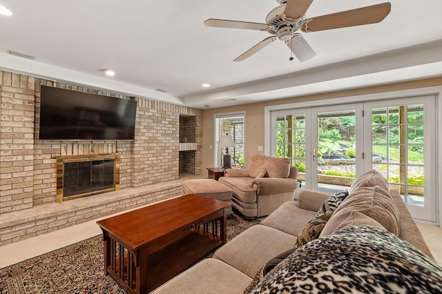 living room featuring recessed lighting, a ceiling fan, carpet flooring, and a brick fireplace