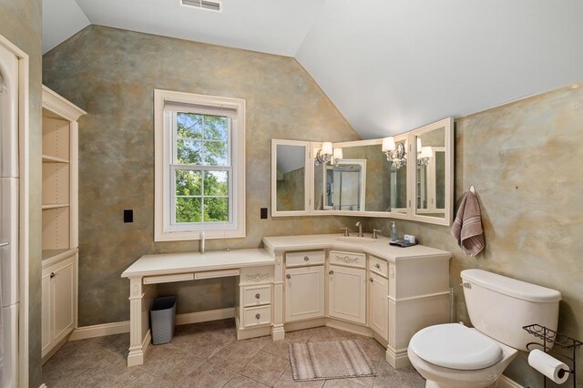 bathroom with lofted ceiling, visible vents, toilet, and vanity