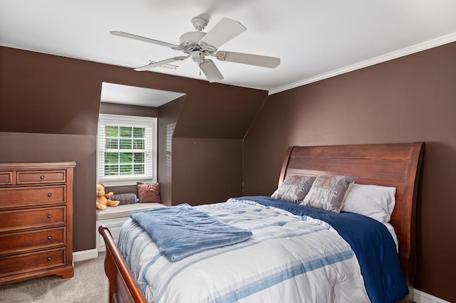bedroom with carpet flooring, baseboards, ornamental molding, a ceiling fan, and lofted ceiling