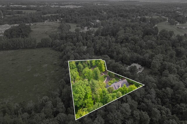 bird's eye view featuring a forest view