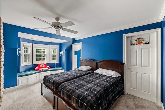bedroom with light colored carpet, crown molding, and a ceiling fan