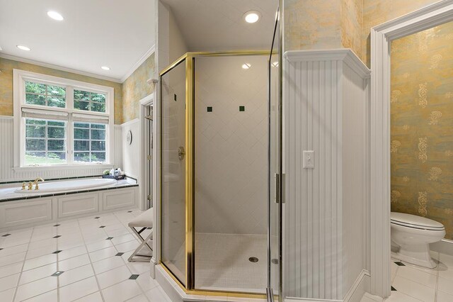 bathroom featuring ornamental molding, wallpapered walls, and toilet