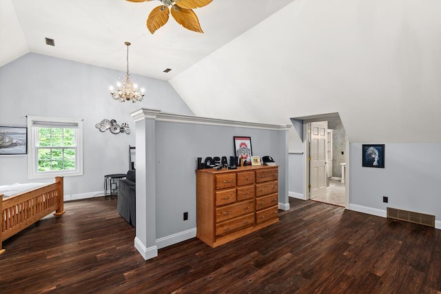 bedroom with baseboards, lofted ceiling, visible vents, and wood finished floors