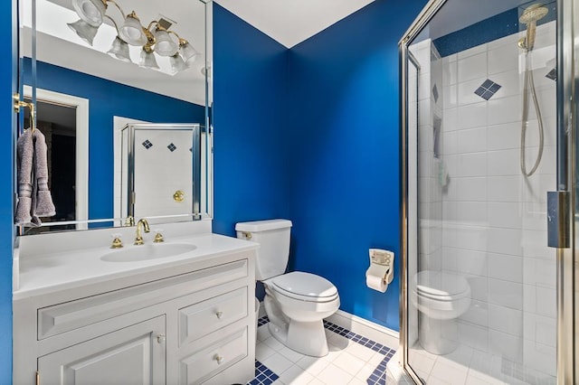 full bath featuring a shower stall, baseboards, toilet, vanity, and tile patterned flooring