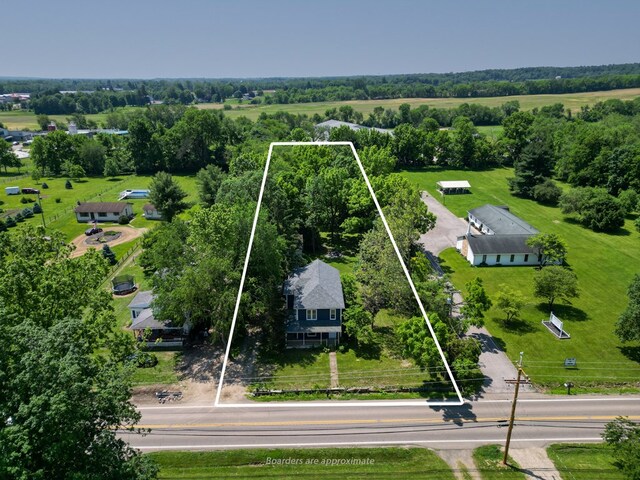 1676 Old Delaware Rd, Mount Vernon, OH 43050 - aerial view of property and surrounding area featuring property parcel outlined and a tree filled landscape