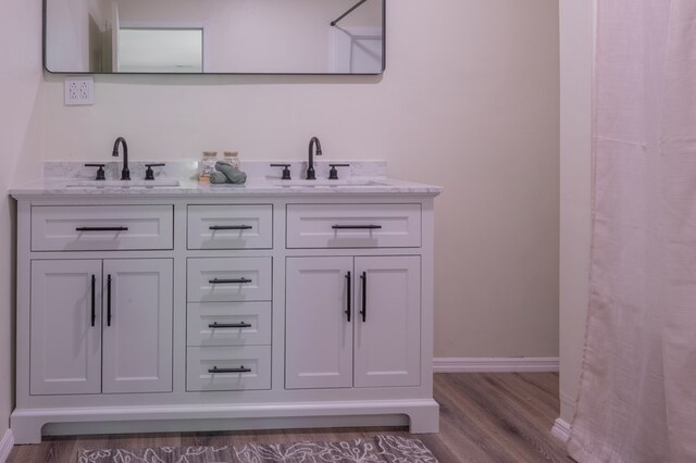 1676 Old Delaware Rd, Mount Vernon, OH 43050 - bar featuring a sink and wood finished floors