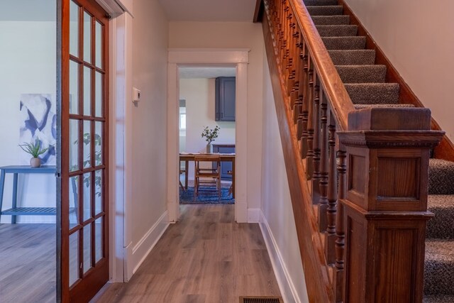 1676 Old Delaware Rd, Mount Vernon, OH 43050 - staircase featuring wood finished floors and baseboards