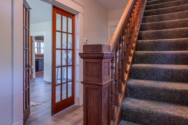 1676 Old Delaware Rd, Mount Vernon, OH 43050 - staircase featuring wood finished floors and french doors