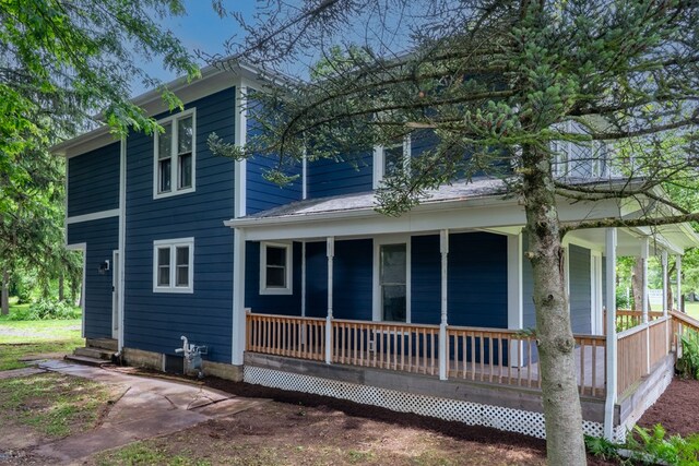 1676 Old Delaware Rd, Mount Vernon, OH 43050 - view of property exterior with covered porch and entry steps