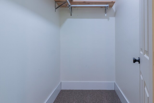 1676 Old Delaware Rd, Mount Vernon, OH 43050 - spacious closet featuring carpet flooring