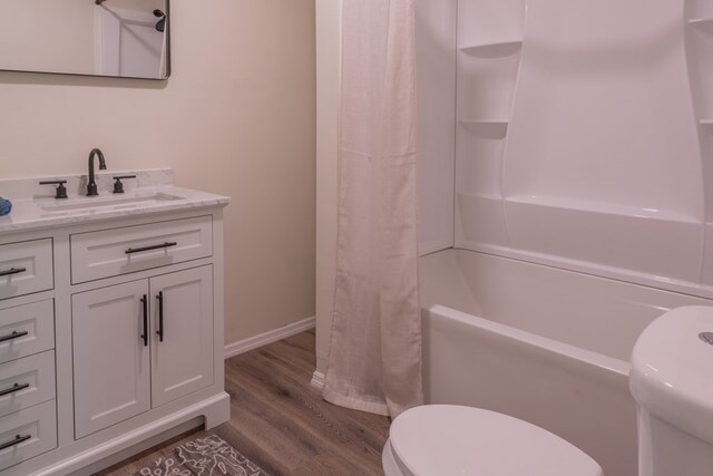 1676 Old Delaware Rd, Mount Vernon, OH 43050 - full bath with wood finished floors, vanity, and shower / bathtub combination with curtain