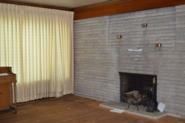 unfurnished living room with hardwood / wood-style flooring and a fireplace