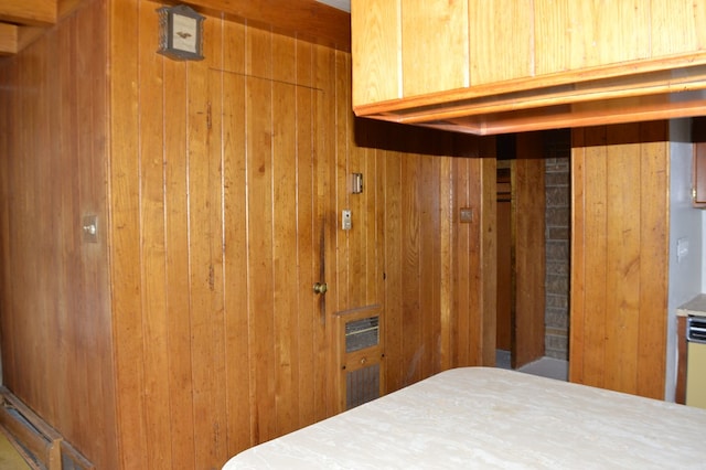 bedroom with wooden walls