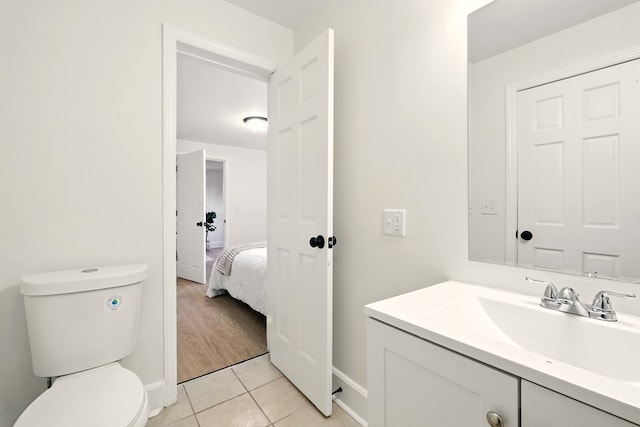 566 Acker Dr, Mansfield, OH 44905 - bathroom featuring vanity, toilet, tile patterned flooring, and baseboards