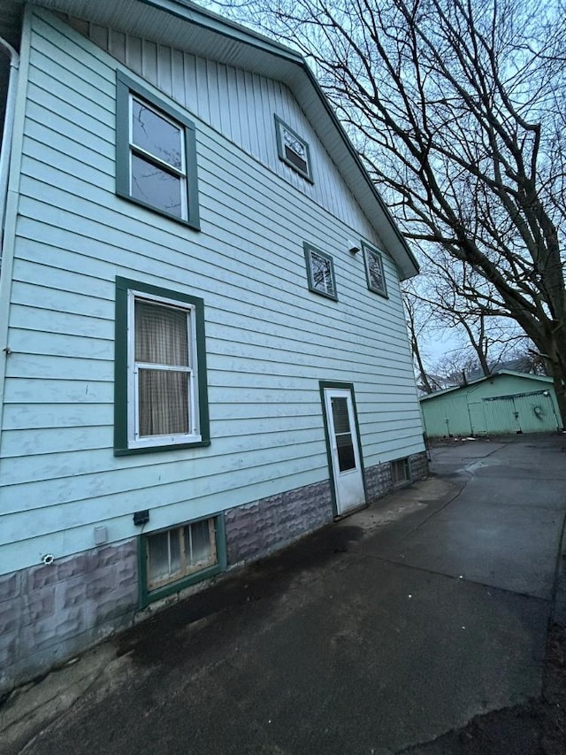 view of property exterior with a patio