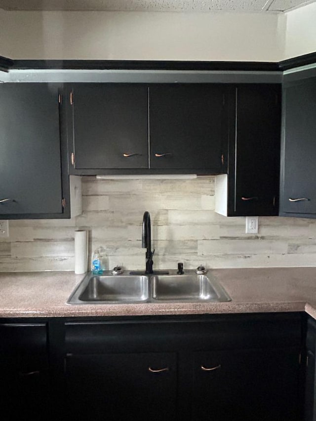 kitchen featuring sink and backsplash