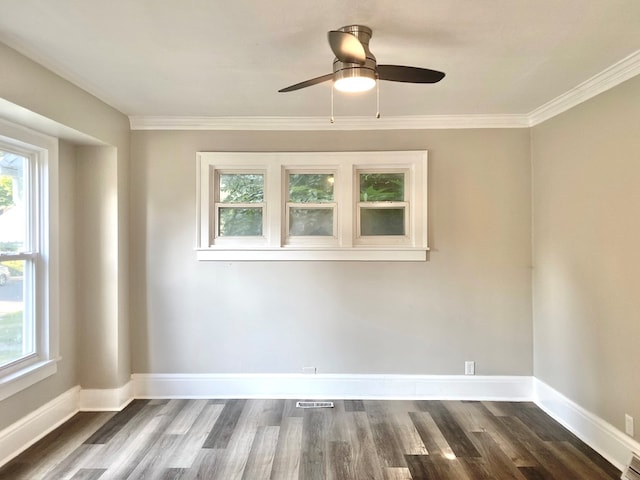 unfurnished room with crown molding, ceiling fan, plenty of natural light, and dark wood-type flooring