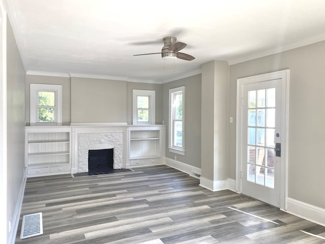 unfurnished living room featuring hardwood / wood-style floors, ceiling fan, and ornamental molding