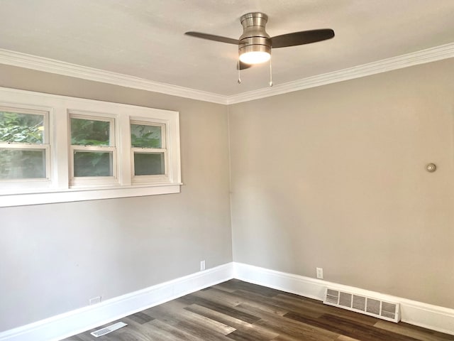 spare room featuring ceiling fan, dark hardwood / wood-style floors, and ornamental molding