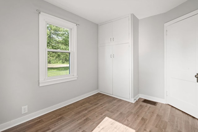 110 Hill St, Edison, OH 43320 - unfurnished bedroom featuring wood finished floors and baseboards
