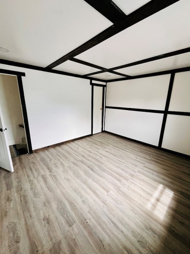 328 Newman St, Mansfield, OH 44902 - additional living space with beamed ceiling, light wood-style flooring, and baseboards