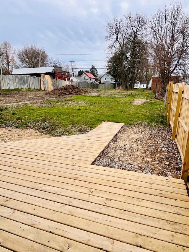 328 Newman St, Mansfield, OH 44902 - wooden deck with an outdoor structure, a lawn, and fence