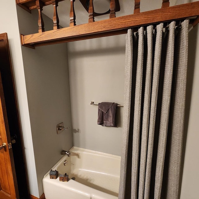 bathroom featuring shower / tub combo with curtain