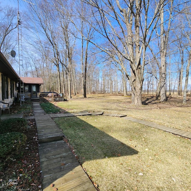 view of yard featuring a wooden deck