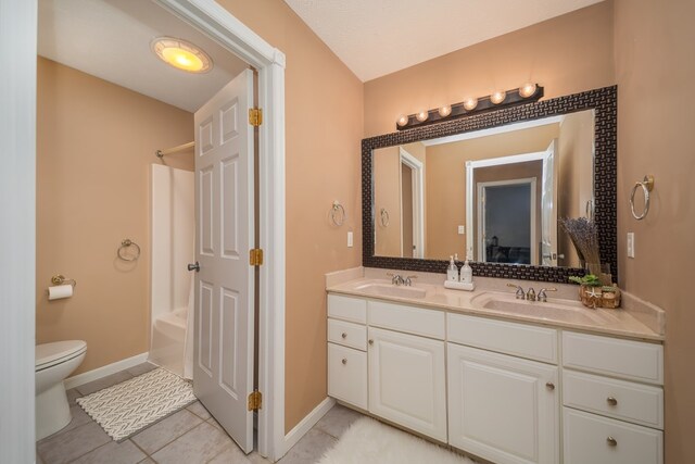 2453 Whitney Ave, Ontario, OH 44906 - bathroom featuring double vanity, shower / bathtub combination, and tile patterned flooring
