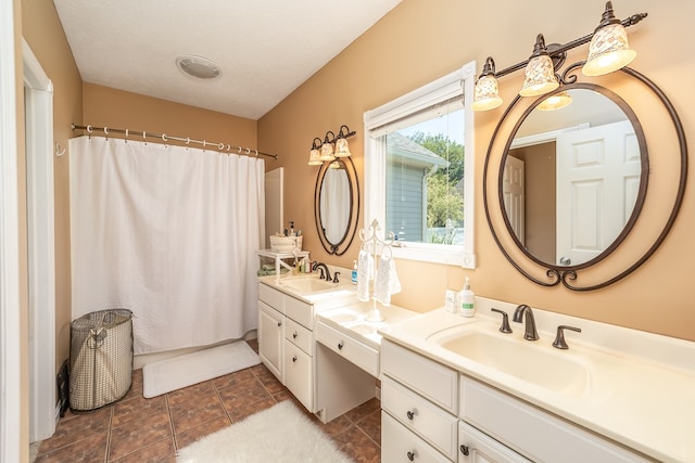 2453 Whitney Ave, Ontario, OH 44906 - bathroom with double vanity and a shower with shower curtain