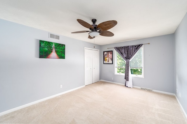 2453 Whitney Ave, Ontario, OH 44906 - spare room featuring light carpet and ceiling fan