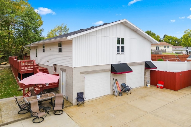 rear view of house with a garage