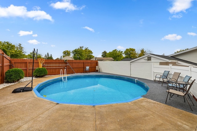 view of swimming pool featuring a patio area