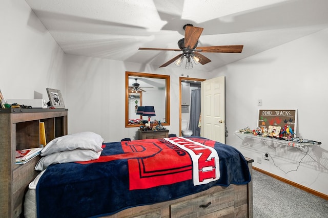 carpeted bedroom with a textured ceiling and ceiling fan