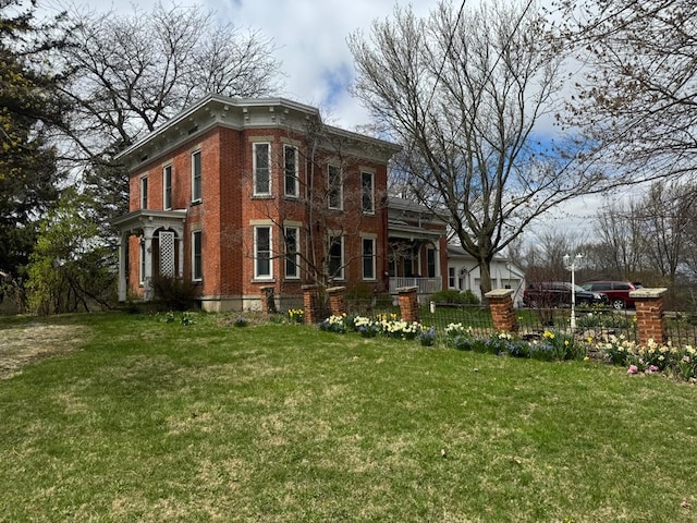 796 US Highway 224, Willard, OH 44890 - view of front of home featuring brick siding, a front yard, and fence