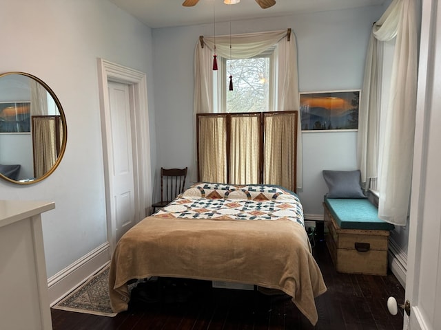 796 US Highway 224, Willard, OH 44890 - bedroom featuring hardwood / wood-style floors, a ceiling fan, baseboards, and baseboard heating