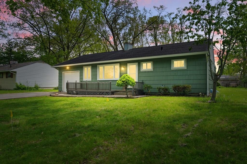 1133 Summit, Ashland, OH 44805 - ranch-style house featuring asphalt driveway, a garage, a yard, and a chimney