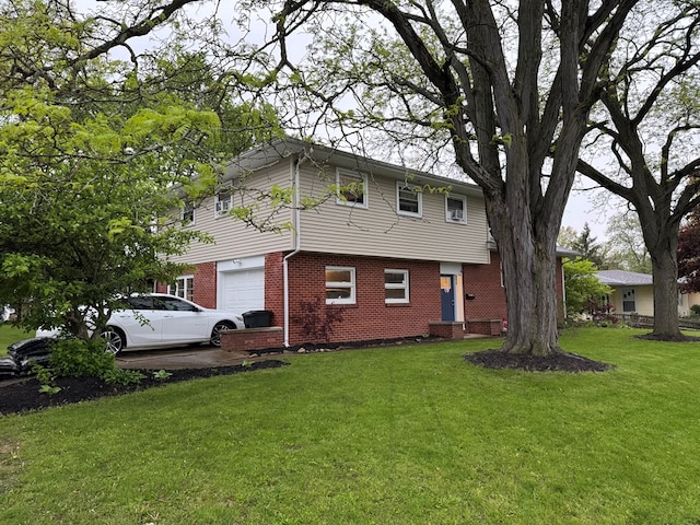 950 Woodbine St, Willard, OH 44890 - view of front facade featuring brick siding, a garage, and a front lawn