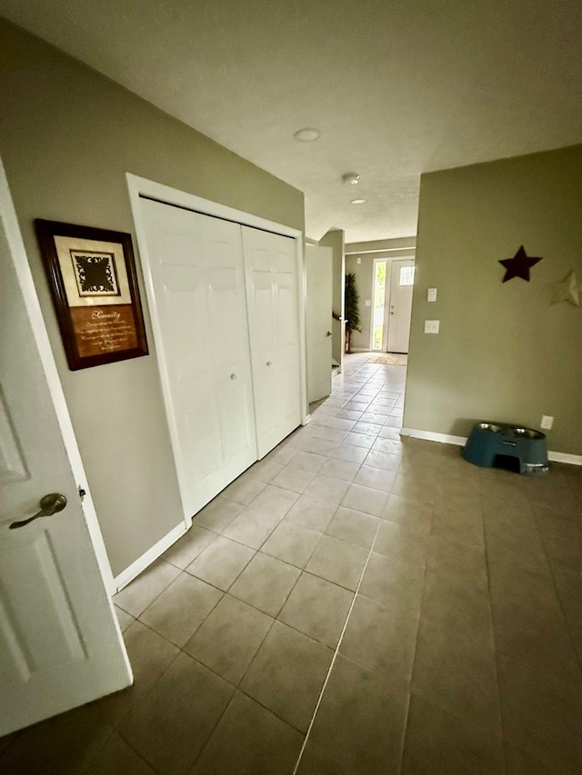 950 Woodbine St, Willard, OH 44890 - hallway with tile patterned floors and baseboards