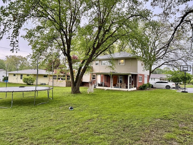 950 Woodbine St, Willard, OH 44890 - view of grassy yard featuring a trampoline