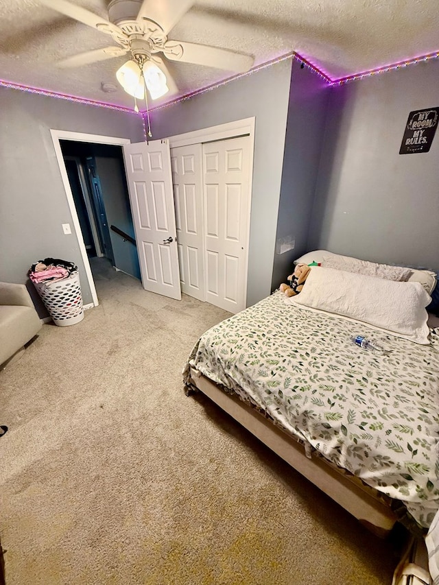 950 Woodbine St, Willard, OH 44890 - bedroom with a textured ceiling, a closet, carpet flooring, and a ceiling fan