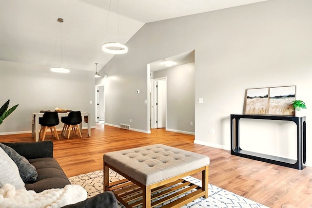 1696 Riva Rdg, Mansfield, OH 44904 - living area featuring vaulted ceiling and light wood-style floors
