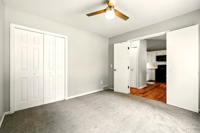 1696 Riva Rdg, Mansfield, OH 44904 - unfurnished bedroom featuring dark carpet, a closet, and a ceiling fan