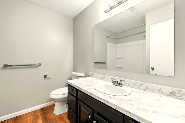 1696 Riva Rdg, Mansfield, OH 44904 - bathroom with wood finished floors, vanity, a shower, and a textured ceiling