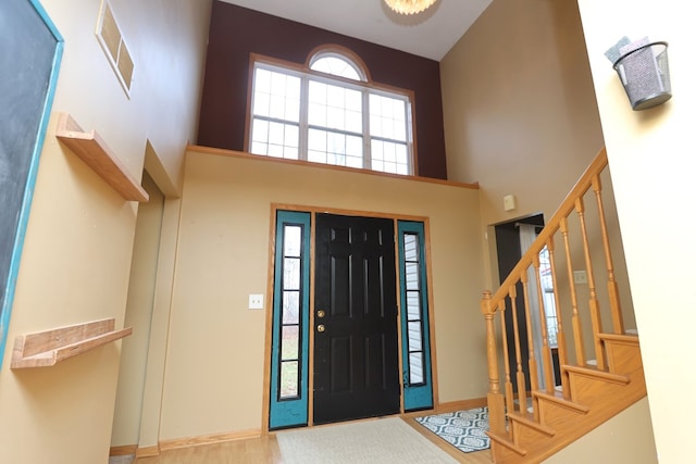 entrance foyer featuring a high ceiling